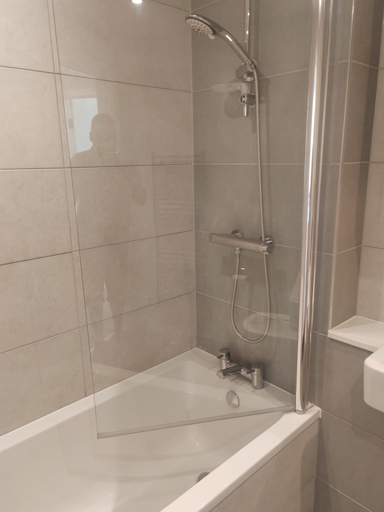 Bathroom shower and bath area cleaned and descaled after an end of tenancy visit
